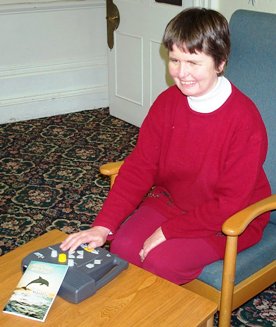 Visually Impaired Person reading Every Day with Jesus using DAISY CD Player. Click here to go to Torch literature resources 
